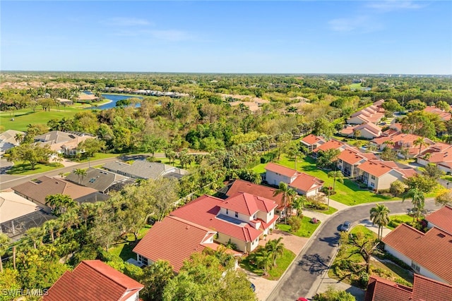 birds eye view of property featuring a water view and a residential view