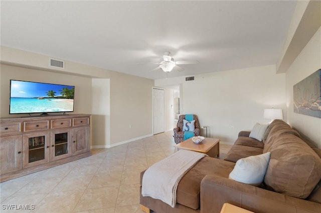 living room featuring visible vents, baseboards, and light tile patterned flooring