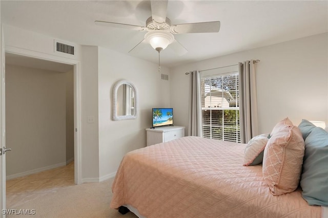 bedroom featuring light carpet, baseboards, visible vents, and a ceiling fan