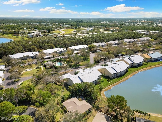 drone / aerial view with a water view and a residential view