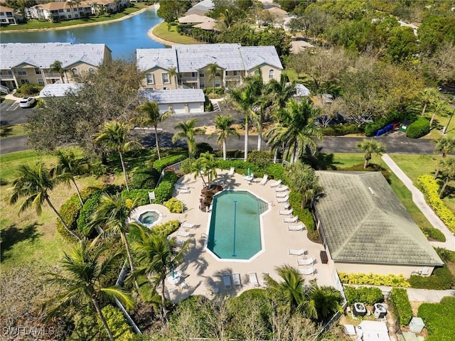 birds eye view of property with a residential view and a water view