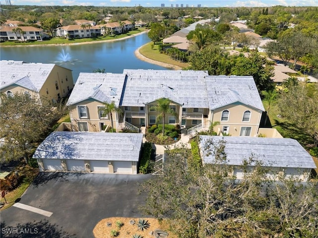 bird's eye view with a residential view and a water view