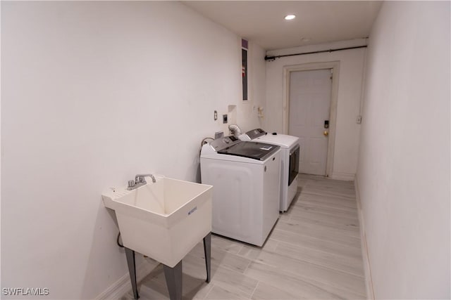 clothes washing area with laundry area, recessed lighting, baseboards, and washing machine and clothes dryer