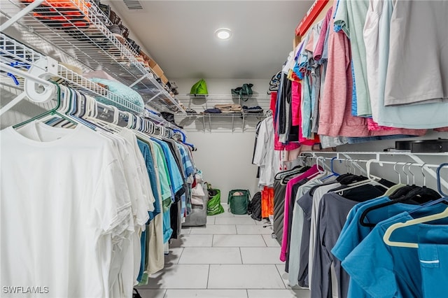 spacious closet featuring tile patterned flooring