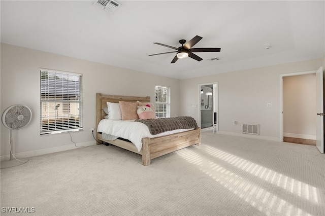 bedroom featuring carpet floors, multiple windows, and visible vents