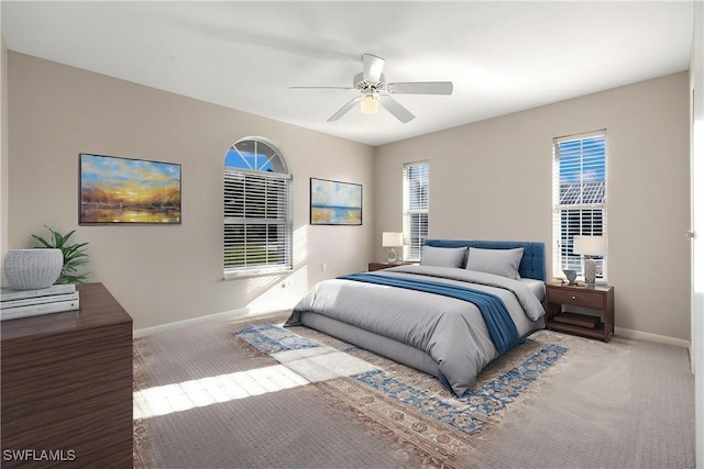 1261 Riverbend Dr, Labelle, FL 33935 - carpeted bedroom featuring baseboards and ceiling fan