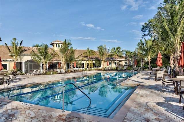 community pool featuring a patio area