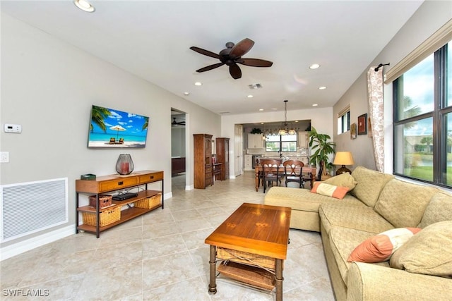 living area featuring a ceiling fan, recessed lighting, visible vents, and light tile patterned floors