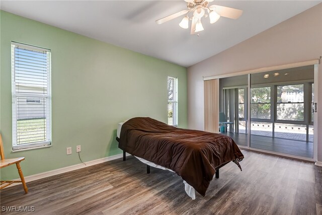 bedroom with access to exterior, vaulted ceiling, baseboards, and wood finished floors