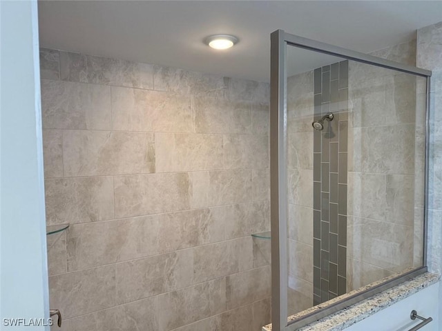 full bathroom with a shower stall