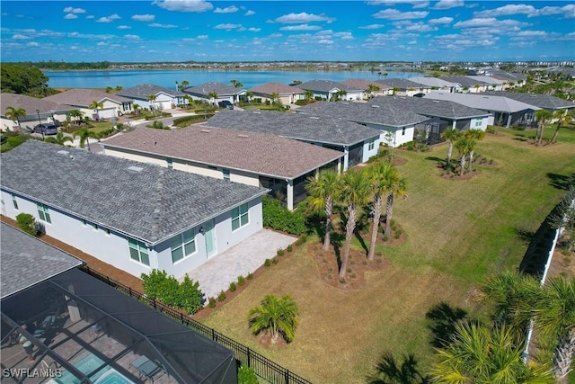 bird's eye view with a residential view and a water view