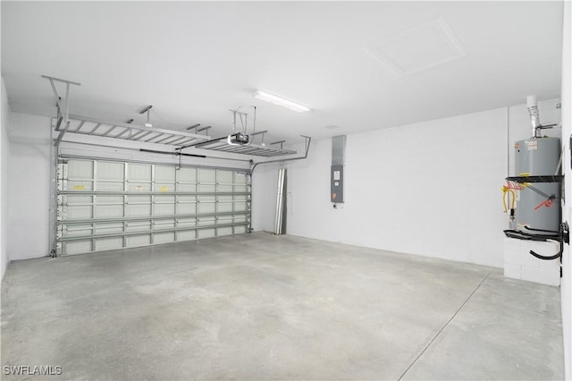 garage featuring gas water heater and a garage door opener