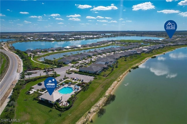 birds eye view of property with a water view and a residential view