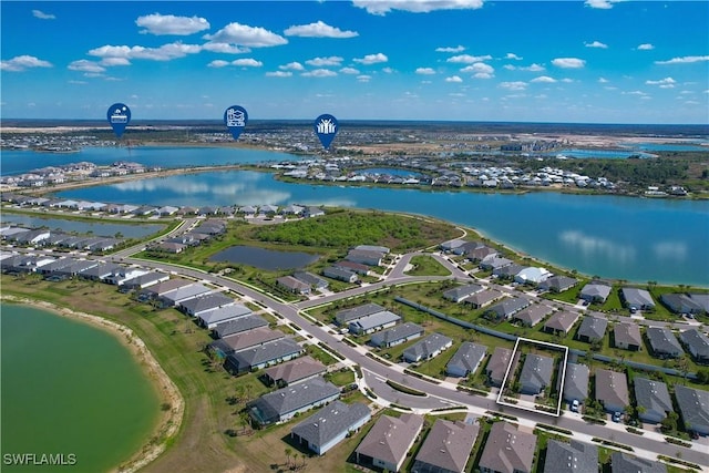 aerial view with a water view and a residential view