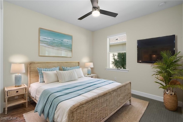 bedroom featuring ceiling fan and baseboards