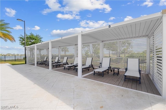 view of patio / terrace featuring fence