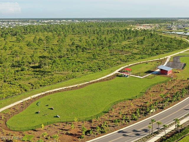 birds eye view of property with a view of trees