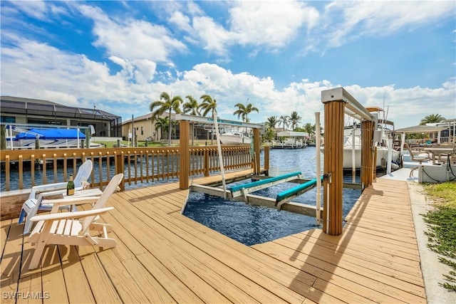 dock area featuring a water view and boat lift