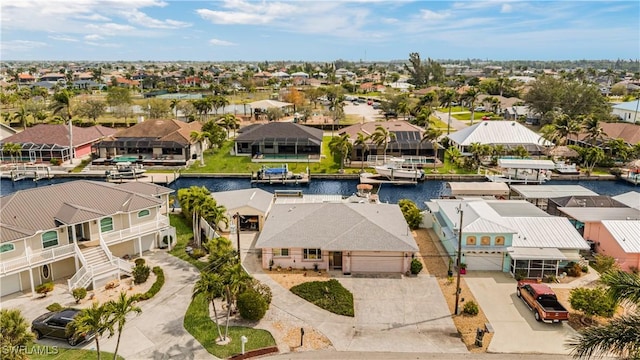 bird's eye view with a residential view and a water view