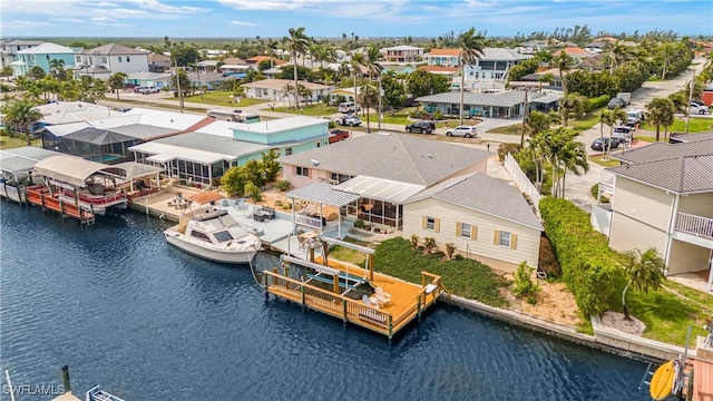 bird's eye view with a water view and a residential view