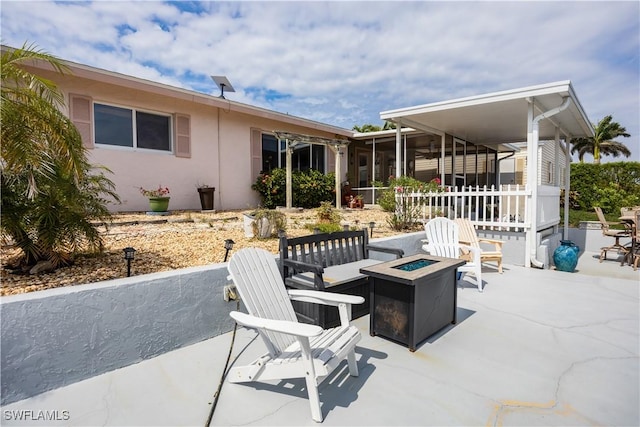 view of patio / terrace featuring a fire pit