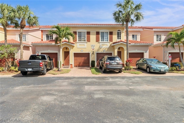 view of front of home with driveway and stucco siding