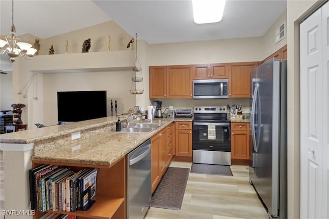 kitchen with stainless steel appliances, a peninsula, a sink, visible vents, and open shelves