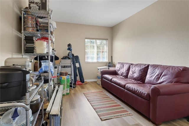 interior space featuring baseboards and wood finished floors