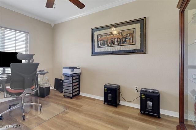 office with baseboards, a ceiling fan, light wood-style flooring, and crown molding