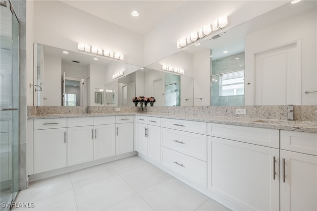 full bathroom with a stall shower, tile patterned flooring, vanity, and recessed lighting