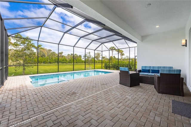 pool with a lanai, an outdoor living space, a lawn, and a patio