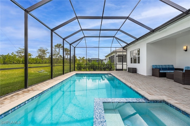 view of pool with a patio, a lanai, a yard, a pool with connected hot tub, and outdoor lounge area