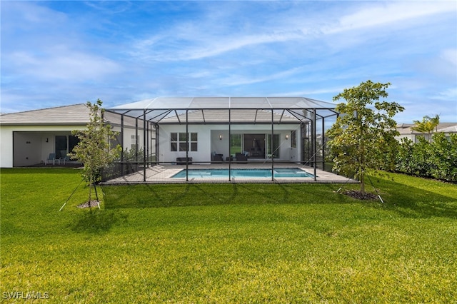 rear view of house featuring glass enclosure, an outdoor pool, a patio, and a yard