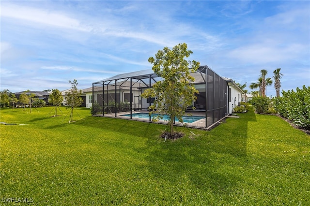 view of yard featuring a lanai and an outdoor pool