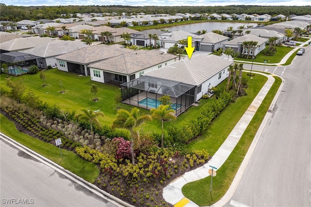 birds eye view of property with a residential view