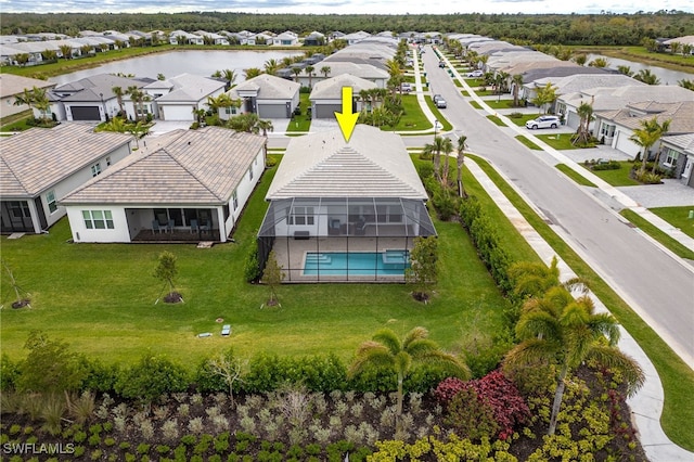 birds eye view of property featuring a residential view and a water view