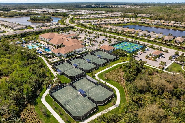 drone / aerial view featuring a water view and a residential view