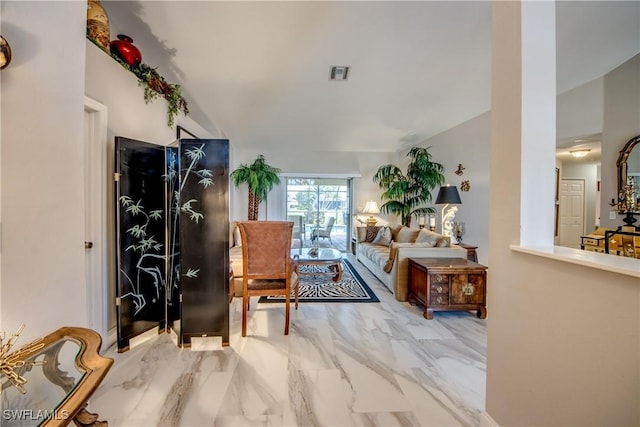 living area featuring marble finish floor and visible vents