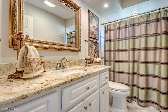 full bathroom with vanity, toilet, and a shower with curtain