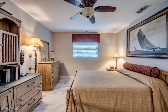 bedroom with a ceiling fan, marble finish floor, visible vents, and baseboards