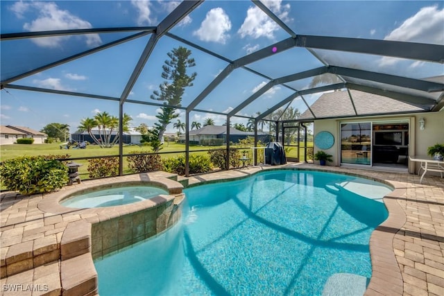 view of pool featuring a lanai, a patio area, and a pool with connected hot tub