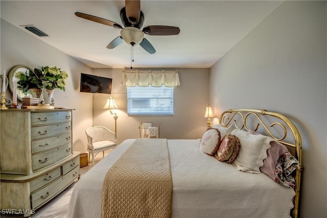 bedroom featuring ceiling fan and visible vents