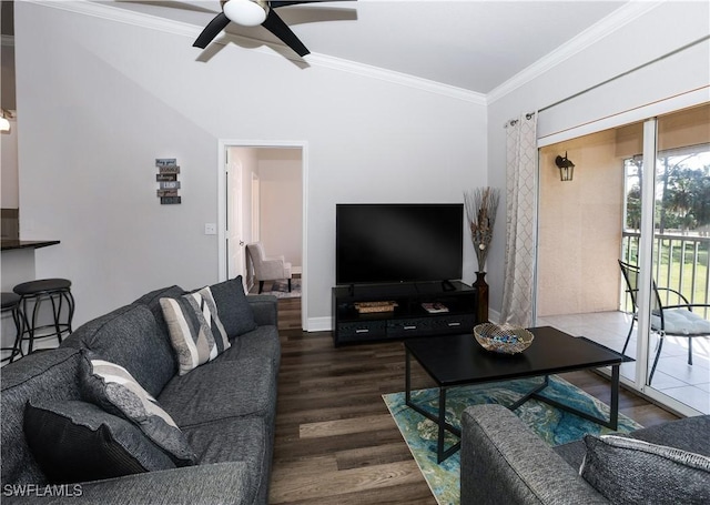 living area with ceiling fan, crown molding, baseboards, and wood finished floors