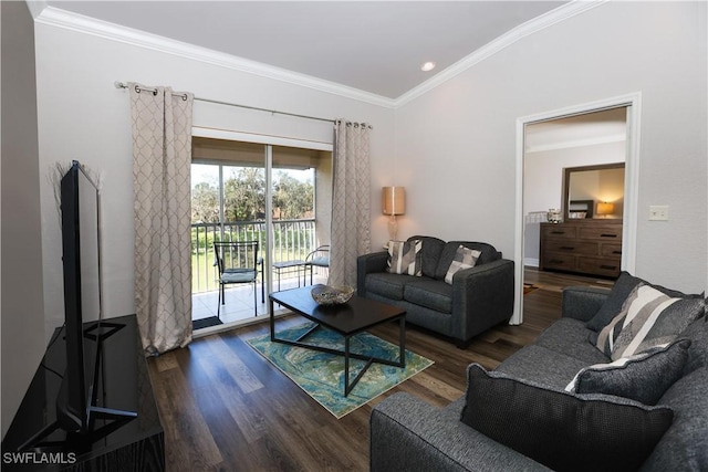 living area featuring ornamental molding and wood finished floors