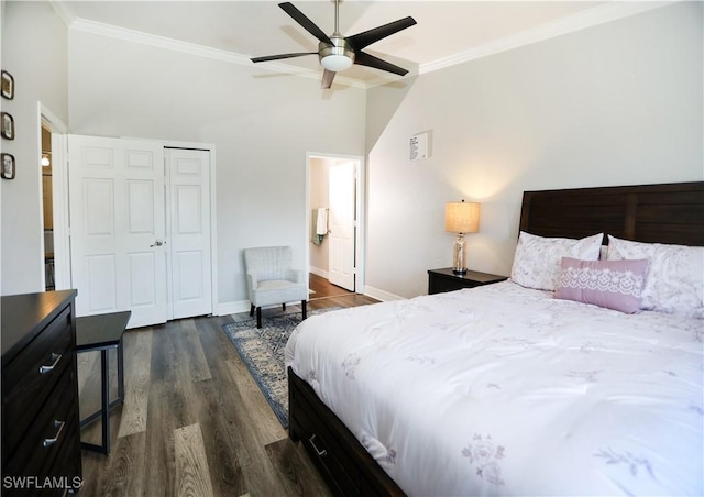 bedroom with dark wood-style flooring, a closet, ornamental molding, ceiling fan, and baseboards