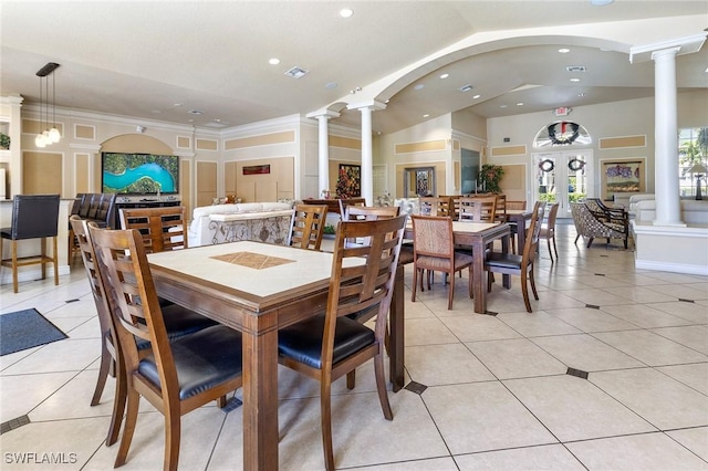 dining area with lofted ceiling, light tile patterned flooring, decorative columns, and recessed lighting