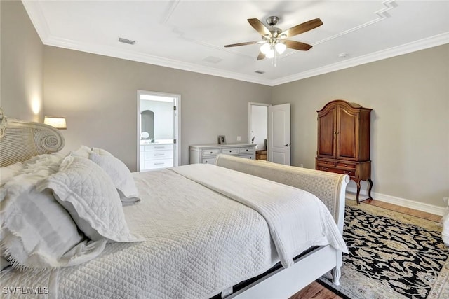 bedroom featuring light wood-style flooring, baseboards, visible vents, and ornamental molding