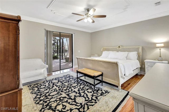 bedroom featuring visible vents, crown molding, baseboards, and access to outside