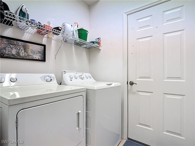 washroom with laundry area and independent washer and dryer