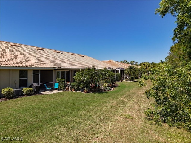 view of yard featuring a patio area and cooling unit